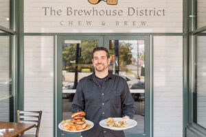 Nick standing at the door of the Brewhouse District