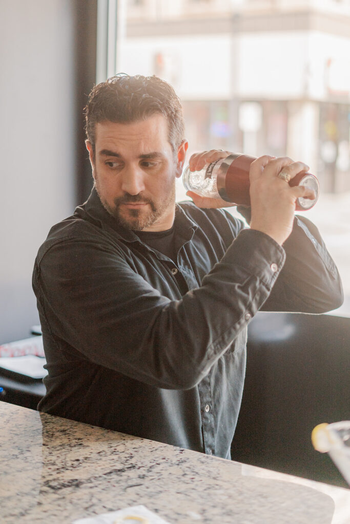 Nick mixing a drink at the bar