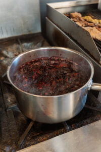 Hibiscus flowers being boiled to make juice