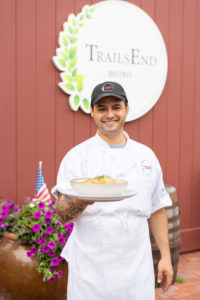 Chef with tuscan chicken gnocchi