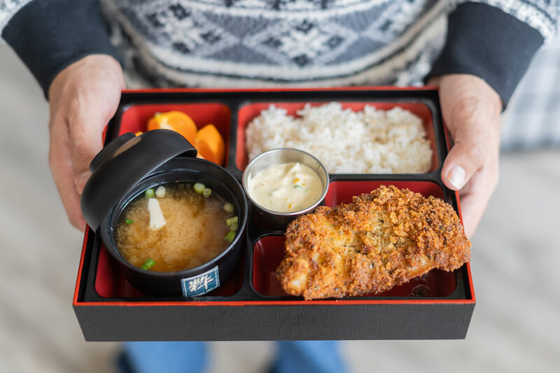 William Foley holds a lunchtime bento box
