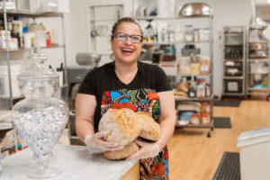 Melissa Sepulveda holding her bread at Forno Bakery