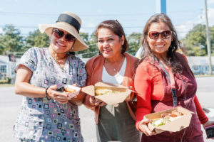 The titas, holding food from Adobo Republic
