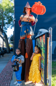 Kids in downtown New Bedford, dressed up in Halloween costumes