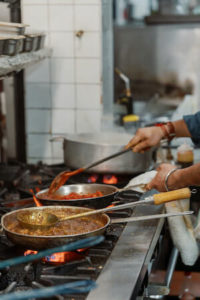 Cooking at the stovetop at Saffron by the Sea