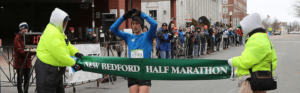Crossing the finish line at the New Bedford Half Marathon