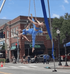 Trapeze artists in a downtwon