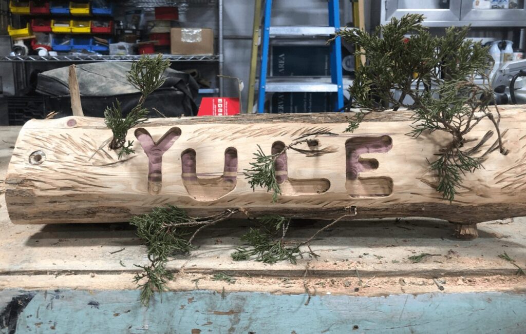 Yule log, with Yule carved into it