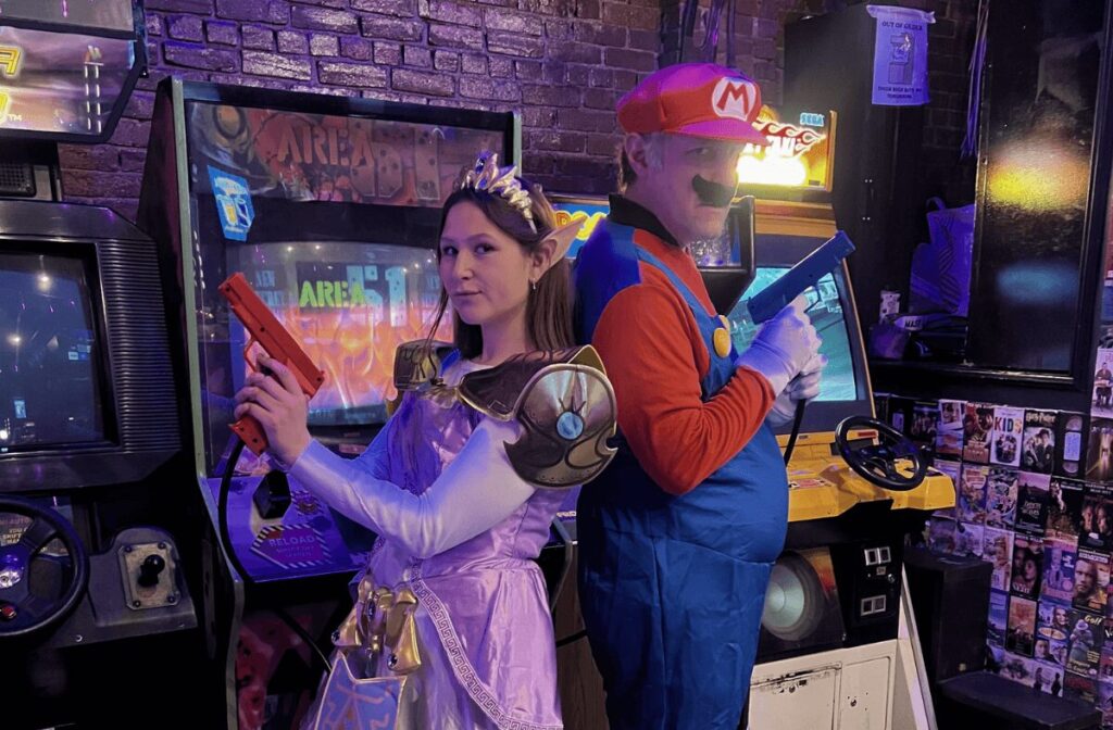 video game characters in front of arcade games