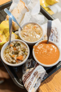 A trio of soups on a tray at Destination Soups