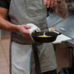 Tyson seasons the Bubbly Buddy breakfast special