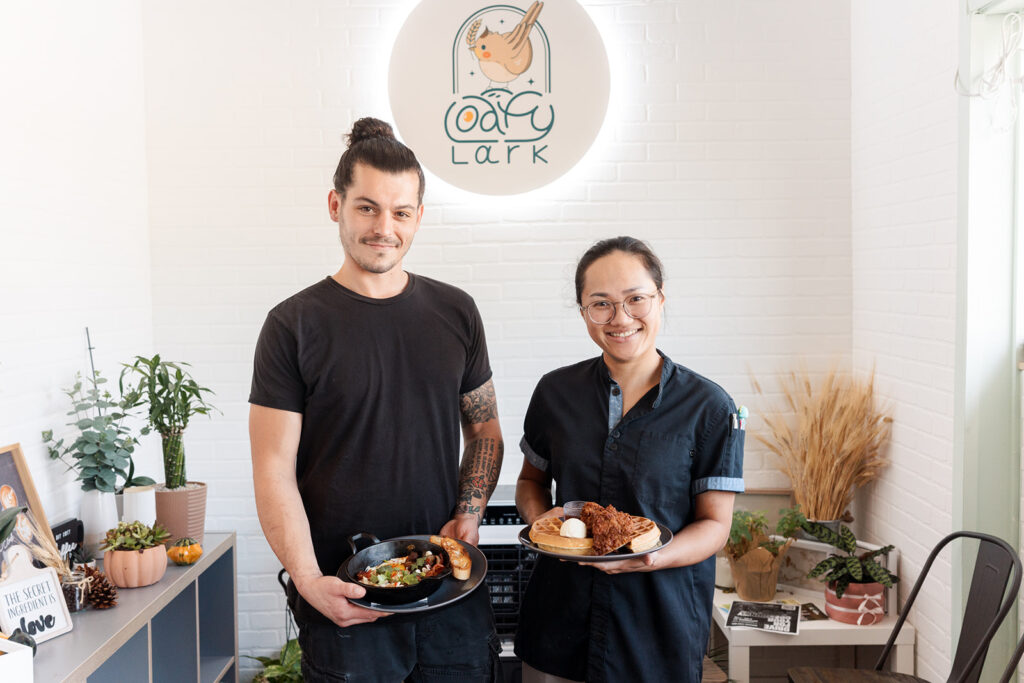 Tyson and Faye, owners of Loafy Lark, holding favorite breakfast specials