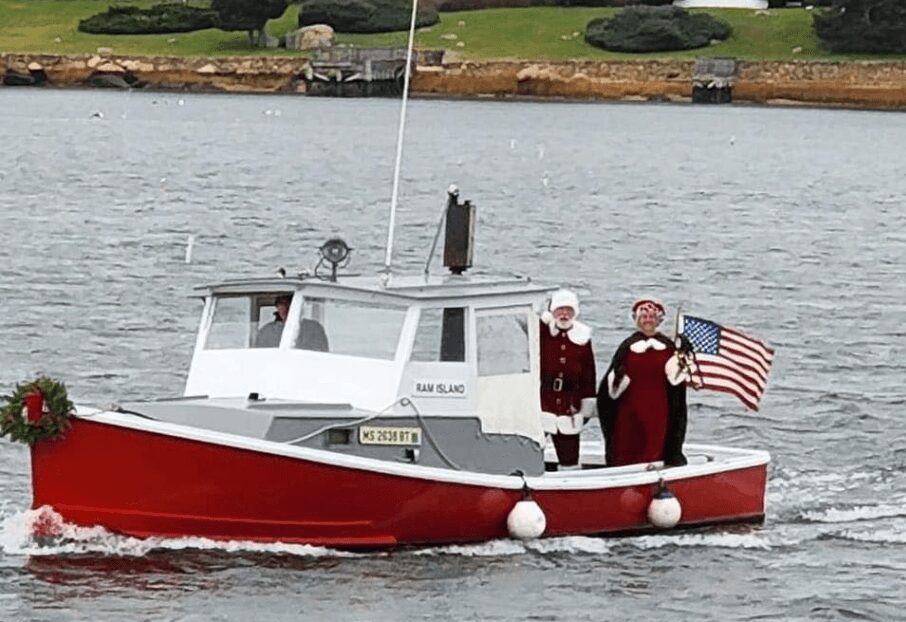 Mr. and Mrs. Claus on a motor boat
