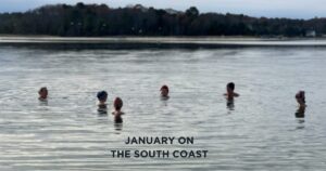 People immersing in Onset bay with winter hats