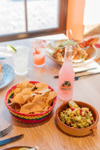 Table set with chips and salsa in the foreground