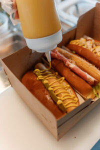 A to-go box filled with hot dogs
