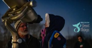 Someone gazing at the stars through a telescope