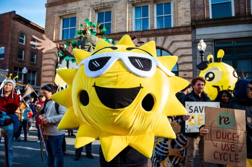 An Aha! parade participant dressed up as the sun!