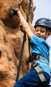 A child on a climbing wall