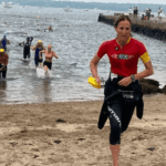 A Mattapoisett Triathlete coming out of the water