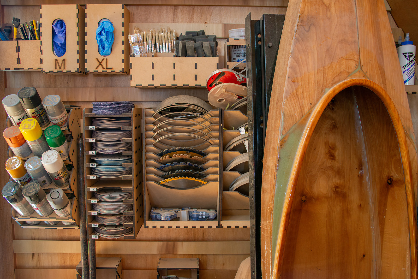 Jackman's workshop, with his custom wooden kayak.