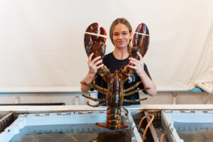 Cassie McDonough holds an 11-pound lobster.