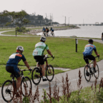 Watershed Riders bike along the water