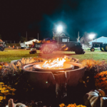 A tractor behind a bonfire at the South Coast Harvest Festival