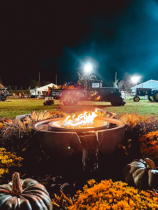 A tractor behind a bonfire at the South Coast Harvest Festival