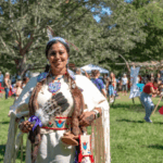 Native American in traditional dress at RTB Farm's powow