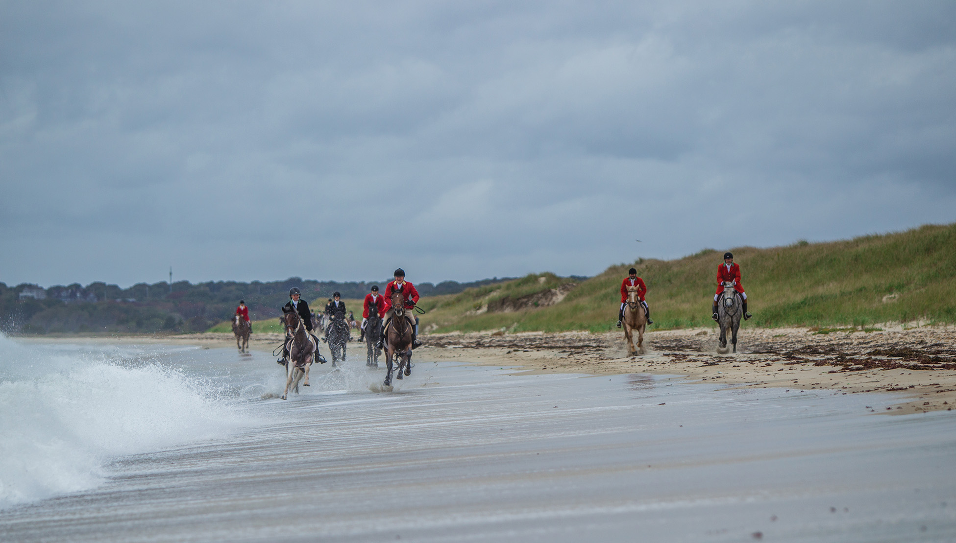 A group of riders from the Norfolk Hunt Club on the beach