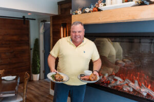 Owner Michael Dearing with two dishes