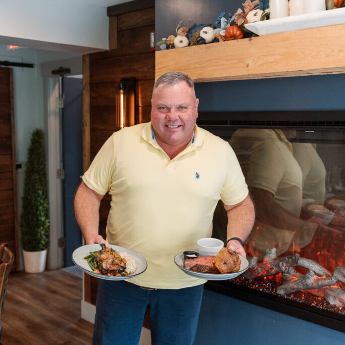 Owner Michael Dearing with two dishes