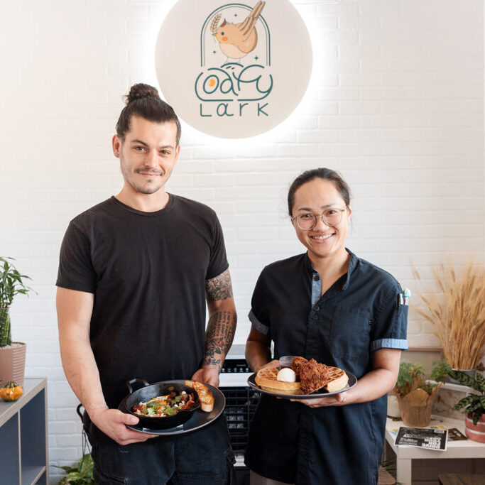 Tyson and Faye, owners of Loafy Lark, holding favorite breakfast specials