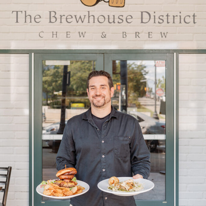 Nick standing at the door of the Brewhouse District