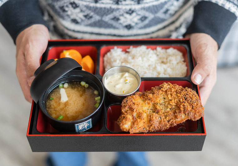William Foley holds a lunchtime bento box