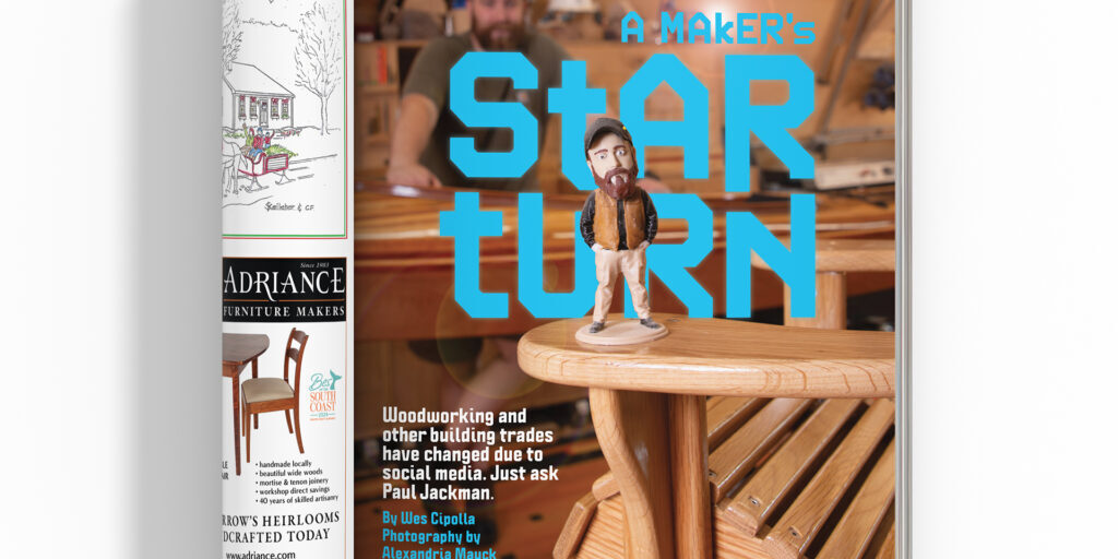 A Paul Jackman figurine sits on a table