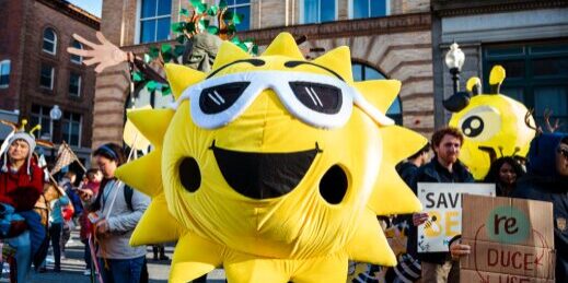 An Aha! parade participant dressed up as the sun!
